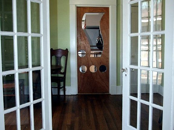 French doors connect living room and dining room