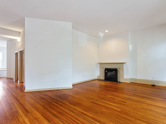 Living room with wood burning fireplace