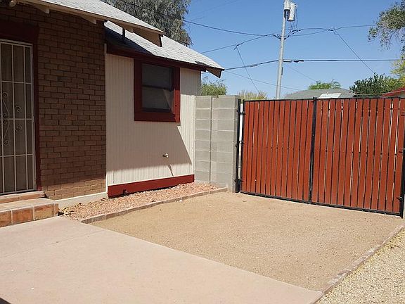 View showing side entrance and gate access to back yard