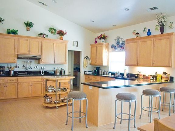 Kitchen with granite counters and island