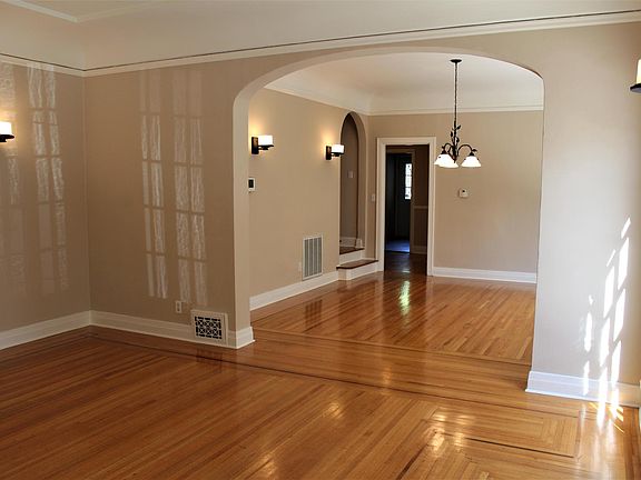 Living room with French windows from entry looking into dining room