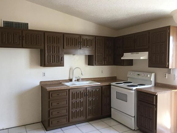 Kitchen has dropped cabinets