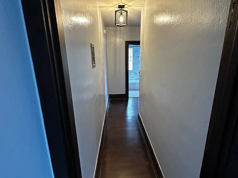 Hallway to bedroom, kitchen & bath