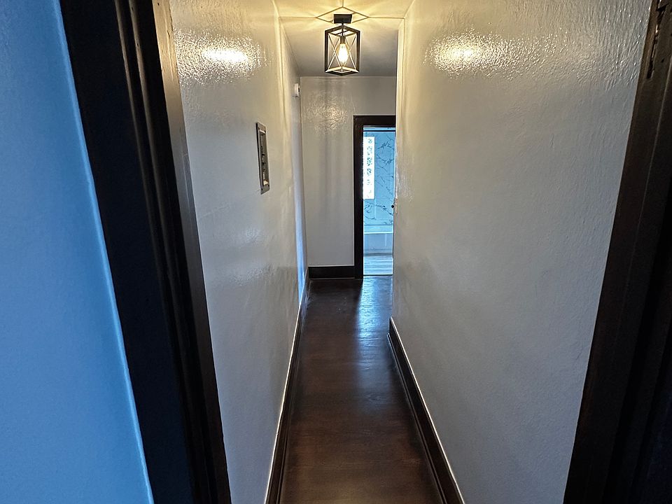 Hallway to bedroom, kitchen & bath