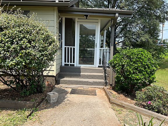 Front entrance and porch with swing