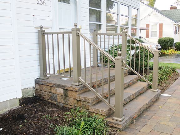 Paver steps with integrated lights and railings