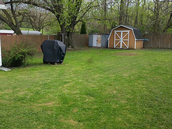 Fenced Backyard with 2 sheds