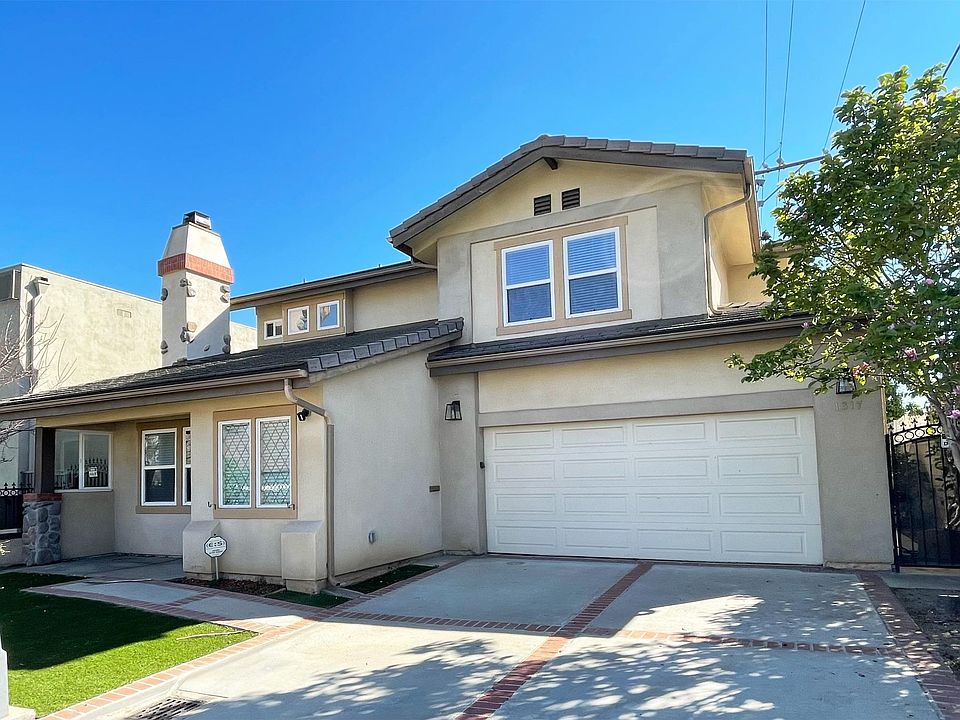 Main Entrance - 1) 2 car attached garage with 4 car driveway 2) New exterior lights with Ring security camera