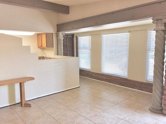 Another View of the Living Area Facing North. Nice 18" Ceramic Tile Throughout the Home. (Photo taken before addition of Breakfast Bar)