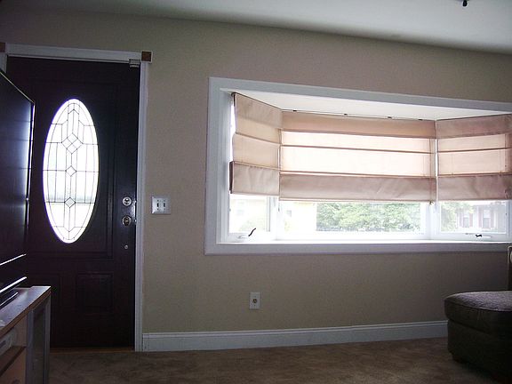 Mahogany/leaded glass door/bay window
