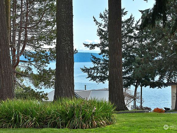 Enjoy living with mountain and sound views, and some grand firs as well!>