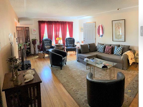 large living room with hardwood floors
