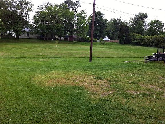 Land behind pole included