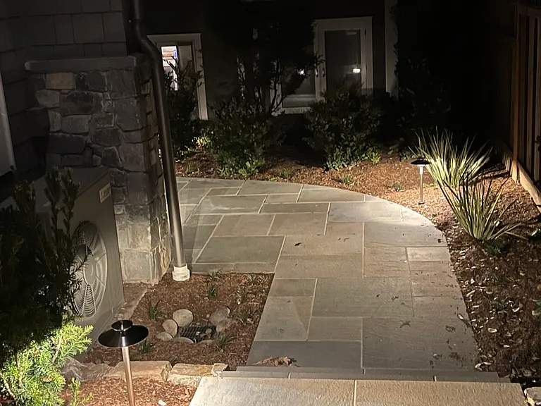 The pathway from the gated entry to the front door (left turn).