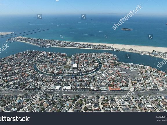 Aerial shot of the peninsula. Beautiful open beach area.