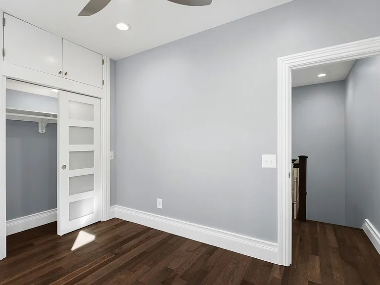 rear master bedroom located only steps from staircase