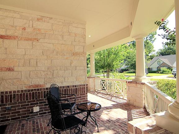 Covered Front Porch looks out over the cul-de-sac on Electra.