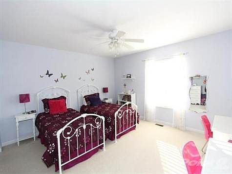 The 2nd bedroom has an attached private bath, ceiling fan, and 2 closets.
