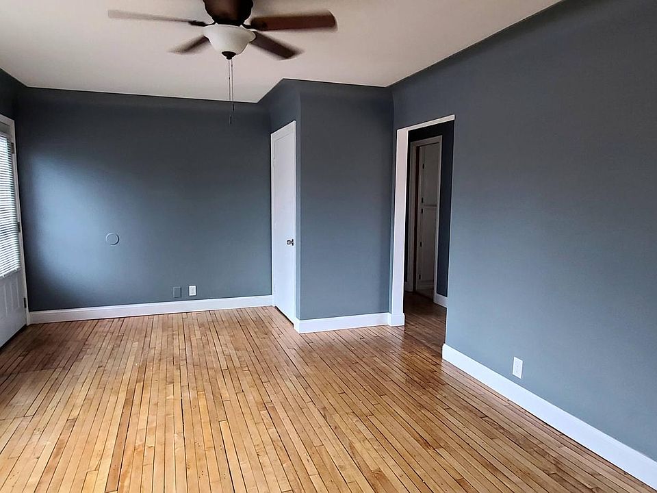 Living room, looking at front door area.