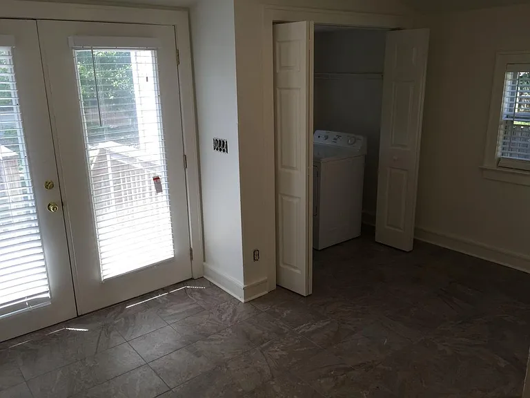 Den off the kitchen w/laundry closet that opens onto large back deck area. Washer and dryer are included in rent.