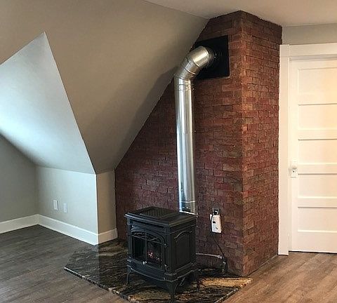 Charming Franklin Stove, mounted on slab of granite--so fun to enjoy in winter.