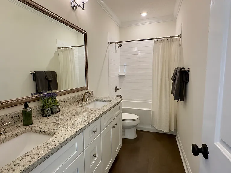 Second full bathroom featuring a soaking tub