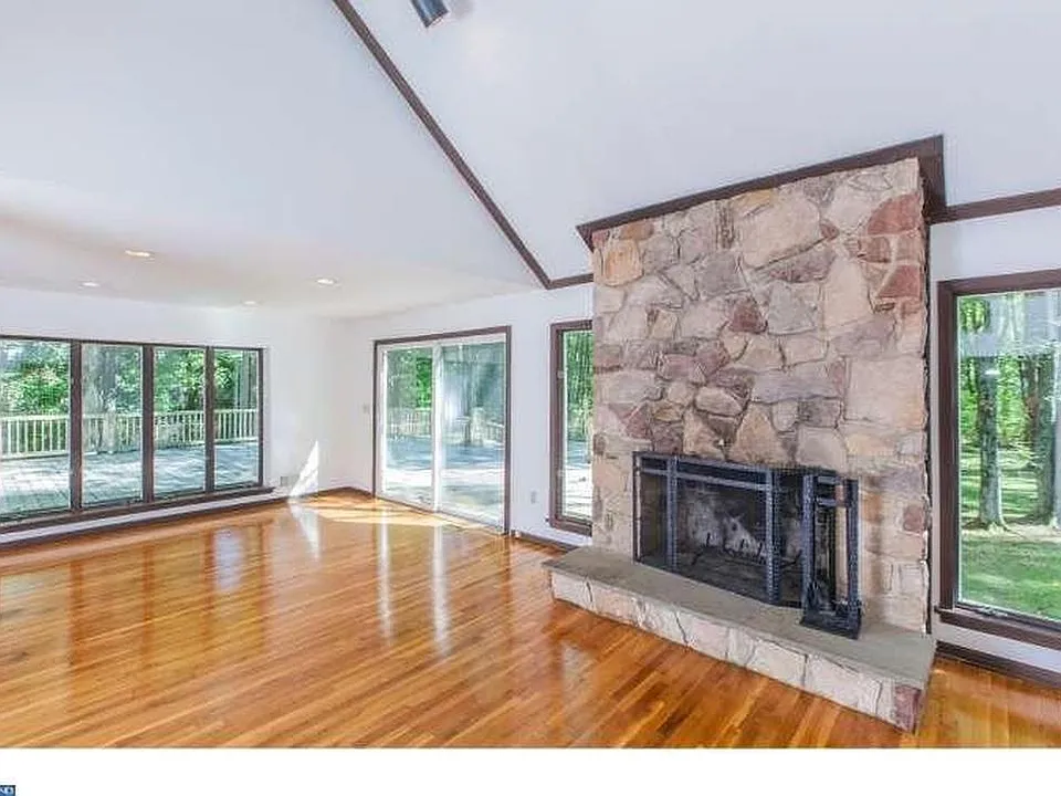 This large room is the keeping room which is located at the back of the house and backs up to four plus acres. A generous portion of the house is fenced if you have large dogs.