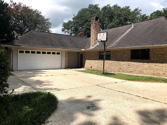 Two car garage plus 2 additional parking spaces by the back door of the house