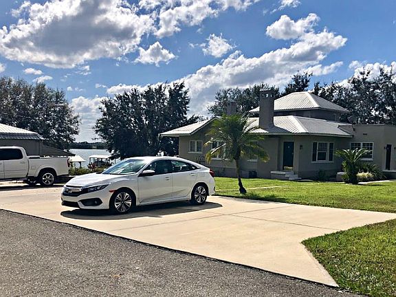 Another view of property showing parking area.