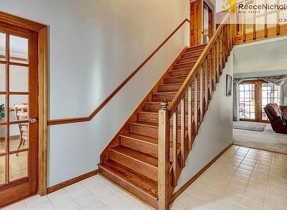 2 sty foyer, to the left is the Formal dining room, to the right is the office/den