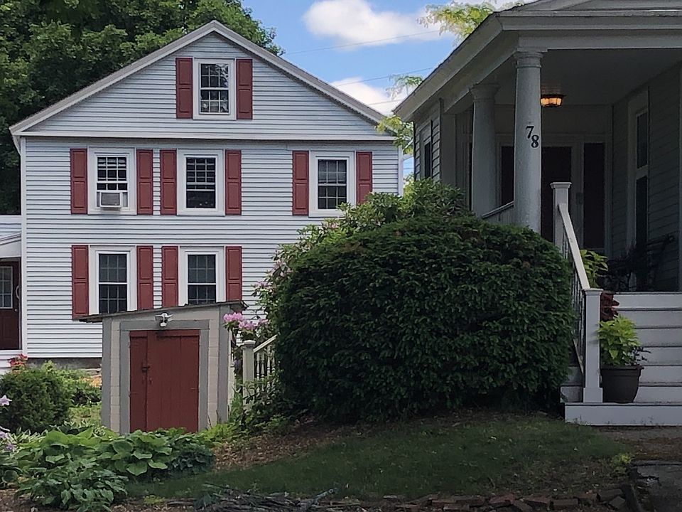Courtyard (between buildings) in Summer. Building on left houses Apt #7 (this ad)