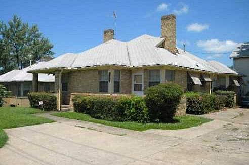 Front view with entry on left, under large covered porch. Turn around in front to allow easy exit from driveway