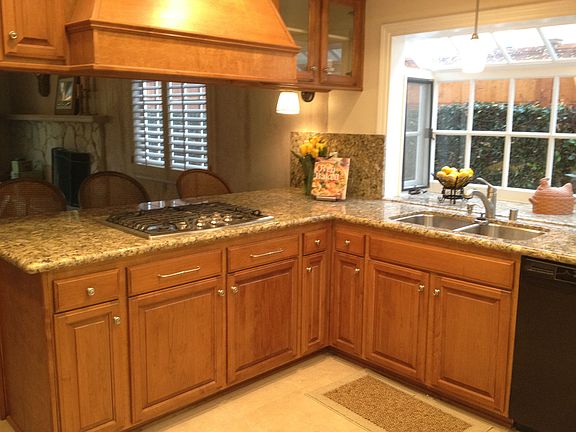 remodeled kitchen with granite counters and greenhouse window