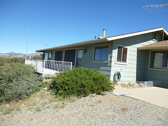 At the top of the driveway.