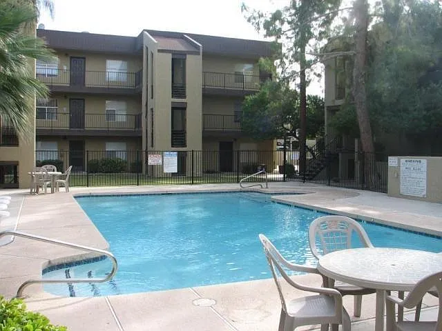 There are four (4) swimming pools and two (2) hot tubs on premises. This picture is of the largest pool near the HOA Clubhouse (that can be rented). There are multiple Ramada's near all the pools that include an outdoor fan, table, chairs, BBQ