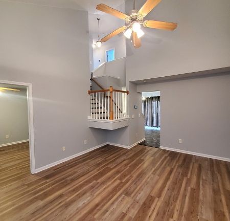 The entrance to the first floor bedroom with full bath is on the left.