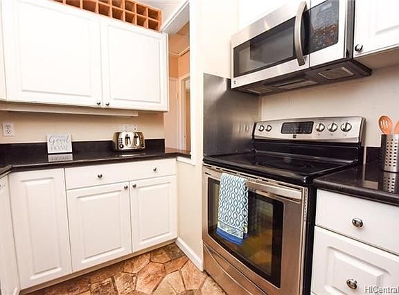 Lovely kitchen ready for your cooking and wine to store!