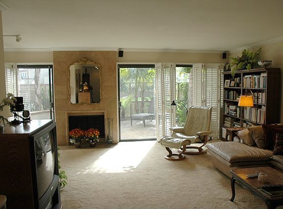 Living Room wiith custom Fireplace open to Greenbelt views