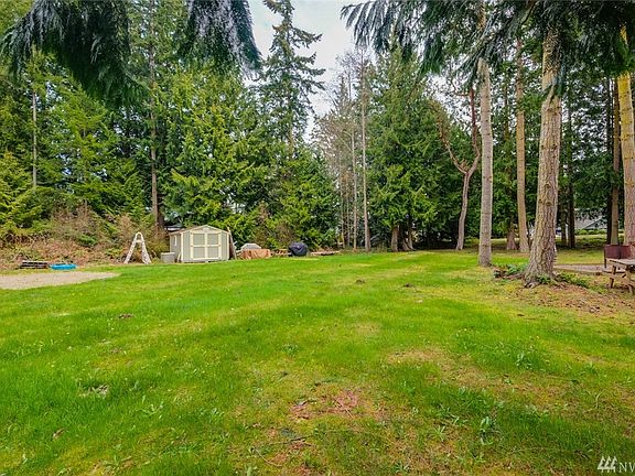 Flat, lightly treed, and all utilities available.  Storage shed w/riding mower stays.