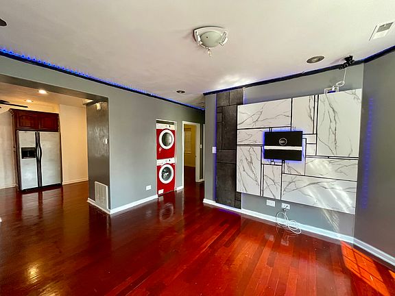 Living room with TV mount and accent wall.