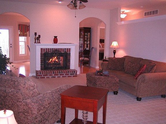 Open Living Room w/Two-sided Fireplace