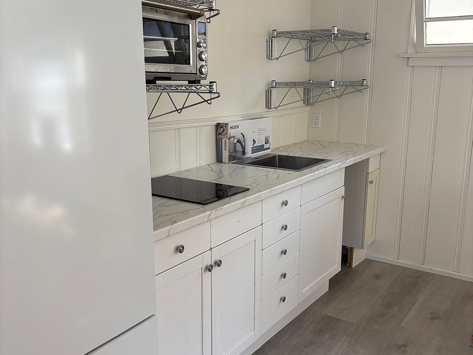 Kitchen w/cook top, microwave, toaster oven and dishwasher