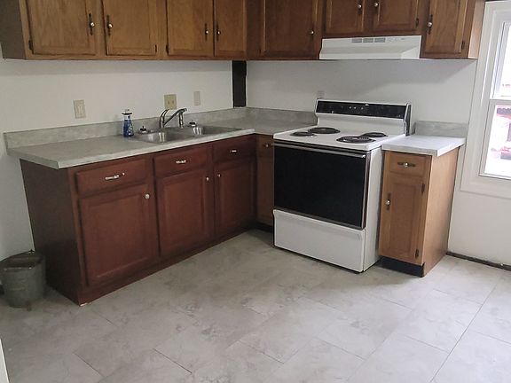 Kitchen (entrance to the basement on the left hand side of photo).