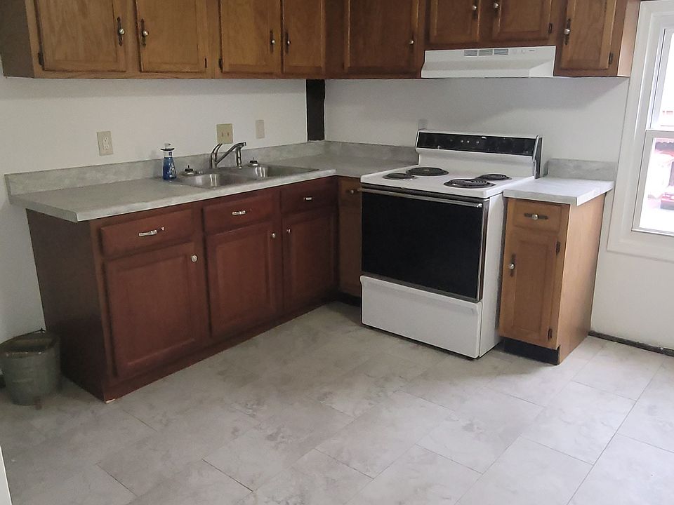 Kitchen (entrance to the basement on the left hand side of photo).