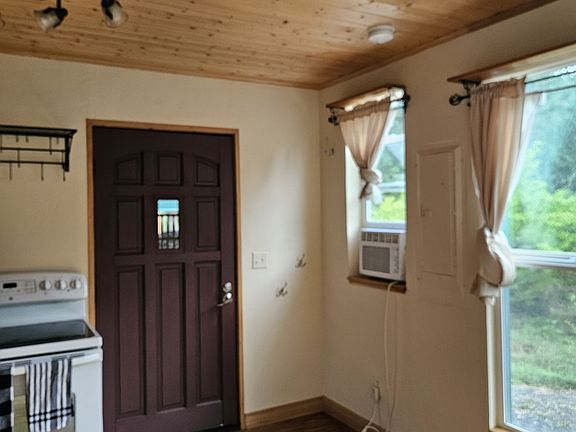 Antique door with modern comfort of AC for hot summer days.