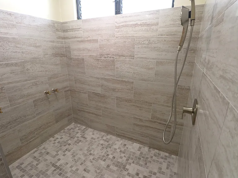 Large tiled step in shower