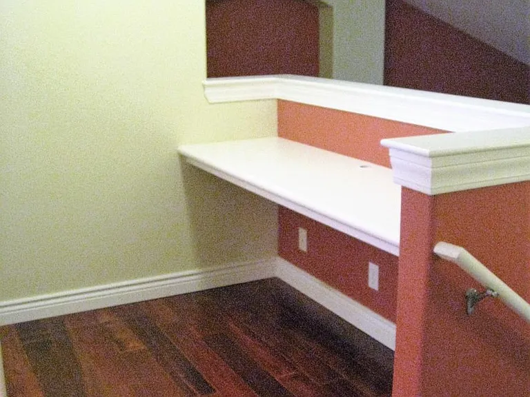 Built in desk/office area at top of stairs landing.