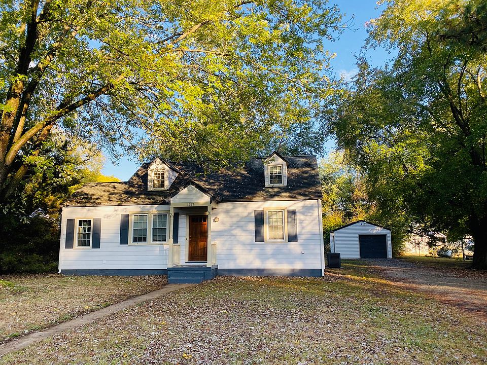Front of the house with the garage in the back right corner