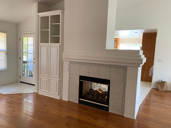 Built in TV cabinet and shelves. Double sided gas fireplace.