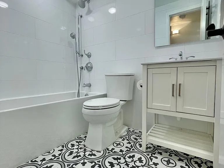 Hallway bathroom with deep tub